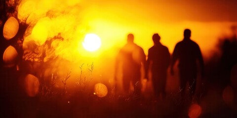 Backlit silhouetted figures stand against a golden sunset, soft lens flare, high-angle shot, ethereal glow outlining their forms, serene scene