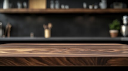 A wooden kitchen countertop with a blurred background of shelves and kitchen items.