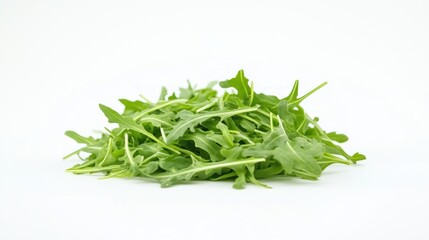 A fresh pile of arugula leaves on a white background, ideal for salads and garnishes.