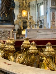 golden candles in cathedral