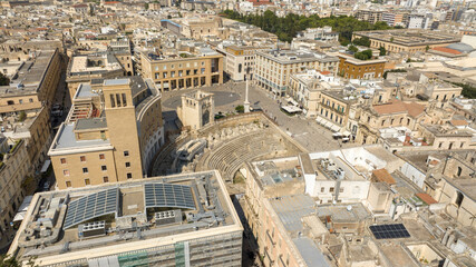 Fototapeta premium Aerial view of Sant'Oronzo square, Palazzo del Seggio and the Roman amphitheater of Lecce, In Puglia, Italy. It is for the people of Lecce the main meeting place.