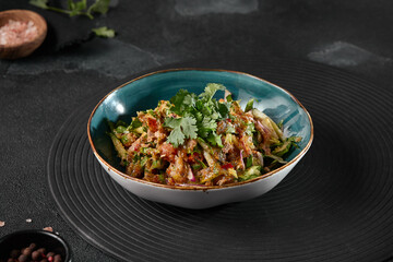 Fresh and Vibrant Georgian Vegetable and Walnut Salad on Dark Background