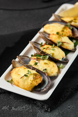 Gourmet Baked Mussels with Cheese Elegant Plating on Dark Background