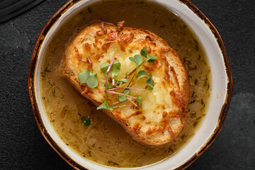 Rustic French Onion Soup with Cheese-Crusted Bread in Warm, Natural Lighting