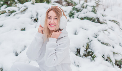 Cute girl in white wool costume, sportswear and fluffy ears, fashionable wardrobe details