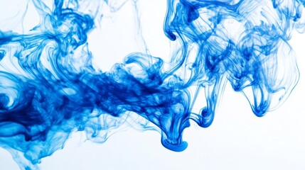 Blue ink swirling in water creating a fluid, abstract form