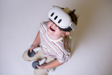 boy with virtual reality glasses on white background. free space. new technologies