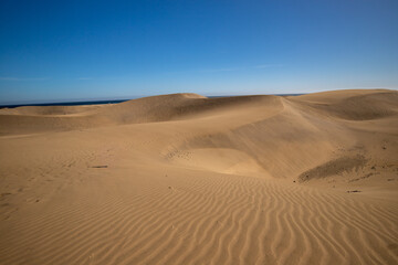 Unidentified woman walking in the Maspalomas dunes on Gran Canaria, Canary Islands, Spain