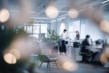 Office team collaboration. Modern office setting with a team of workers collaborating. The blurred background emphasizes teamwork and productivity.
