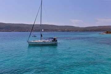 boat on the sea in blue lagoon in Diaporos Island, Sithonia - Greece