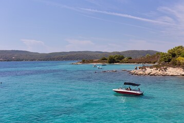 boat on the blue lagoon in Diaporos Island, Sithonia - Greece