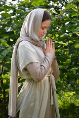 Young girl praying to God