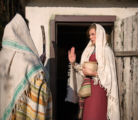 Girl in the door of her home