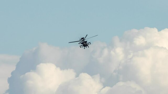 British army Boeing Apache Attack helicopter AH64E (AH-64E ArmyAir606) AH2 performing low level flight manoeuvres