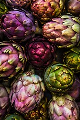 Fototapeta premium Top view of a bunch of ripe, colorful organic artichokes, highlighting their natural beauty variety