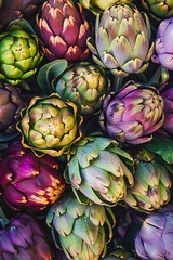Fototapeta premium Top view of a bunch of ripe, colorful organic artichokes, highlighting their natural beauty variety
