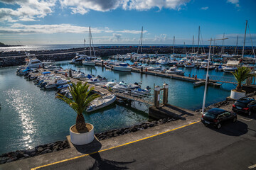 Fototapeta premium A view across the marina in San Roque on the island of San Miguel in the Azores in summertime