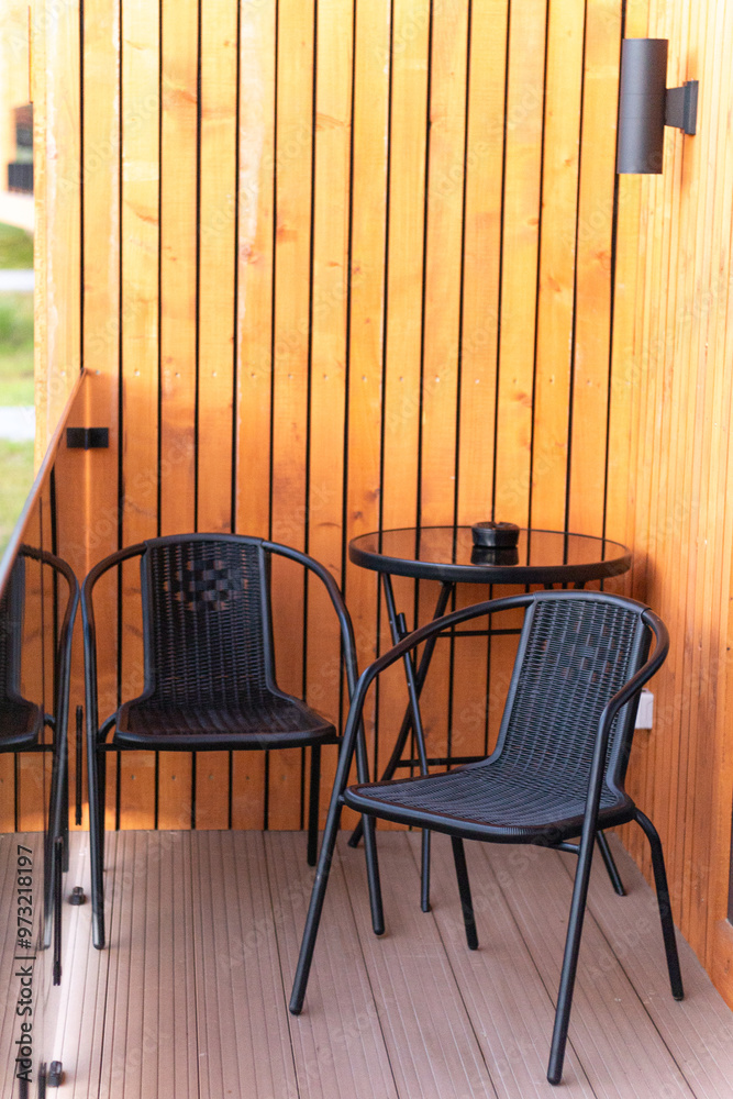 Wall mural balcony, two chairs and a table on the terrace