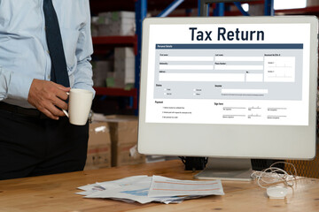 Online tax return form for submitting individual income tax return form snugly on the internet website. Government web for tax payment and return. Taxation technology concept.