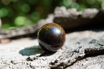 A small ball of tiger's eye. Fortune telling and horoscope.