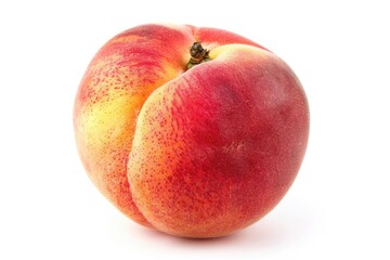 A juicy peach isolated on a plain white surface