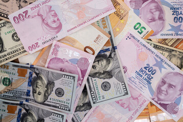 Assortment of Turkish Lira, Euro, and US Dollar banknotes in various denominations. Multinational currency exchange and global finance concept 