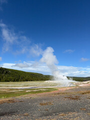 The eruption of Old Faithful in Yellowstone National Park spews steam hundreds of feet into the air