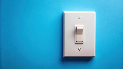 Closeup of white light switch reflected in blue background