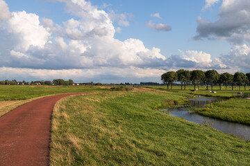 Cycle path through the rural polder area of ​​Eemland in the Netherlands.