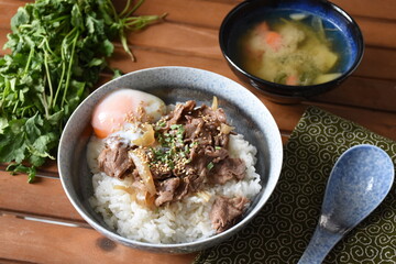 Gyudon is a Japanese beef bowl consisting of thinly sliced fatty beef and onions in a lightly sweet mixture of mirin and soy sauce.