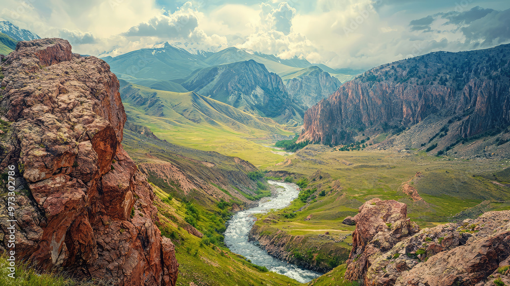 Wall mural a rugged mountain landscape with river winding through valley, showcasing natures beauty