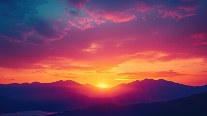 A vibrant sunset over mountain range with colorful skies evokes tranquility