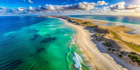 Aerial view of a breathtaking expansive sandy beach with towering sand dunes, clear turquoise waters, and a serene © Four888
