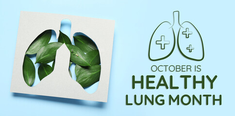 Paper cut out lungs and leaves on blue background