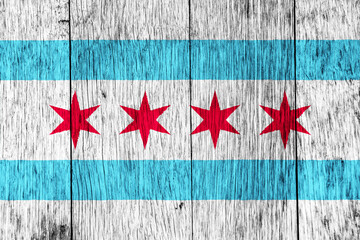 Flag of the city of Chicago, Illinois, USA, on a background of a wooden fence. Conceptual collage