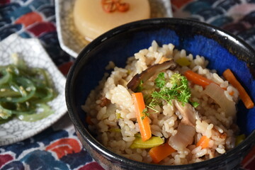 Takikomi Gohan is a Japanese rice dish with short-grain rice with vegetables, mushrooms, seafood, or meat. Often served with pickels and miso soup.