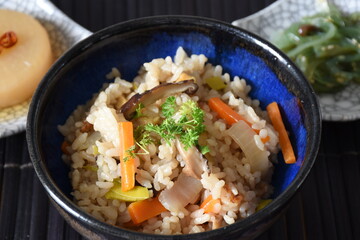 Takikomi Gohan is a Japanese rice dish with short-grain rice with vegetables, mushrooms, seafood, or meat. Often served with pickels and miso soup.