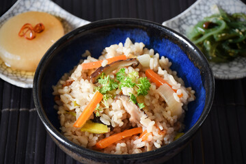 Takikomi Gohan is a Japanese rice dish with short-grain rice with vegetables, mushrooms, seafood, or meat. Often served with pickels and miso soup.