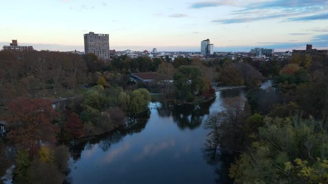 Aerial landscape of Prospect Park lake and Brooklyn Manhattan Skylines during fall in New York City