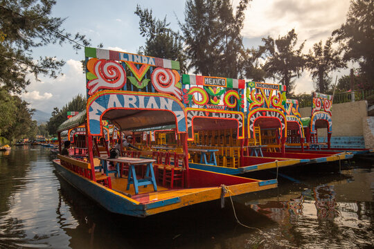 Trajineras Xochimilco, tourist area on a canal with boat rides and mariachi music in Mexico