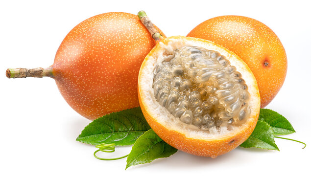 Granadilla and open granadilla with black seeds and gelatinous pulp isolated on white background.
