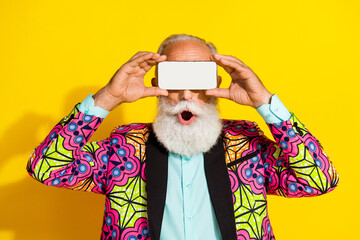 Photo of handsome pensioner mister amazed cover eyes headset dressed colorful pink classy garment...