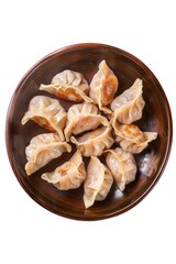 Traditional Chinese dim sum dumplings served in a brown bowl, captured from above against a white