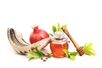 Shofar, pomegranates and honey symbol of the Jewish holiday-Rosh Hashanah white background.