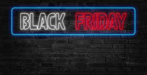 Obraz premium Black Friday Neon sign on wooden background. Bright advertising at night.