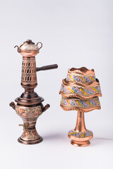 Traditional Arabic Copper Samovar and Handcrafted Copper Lamp with Colorful Pattern Isolated on...