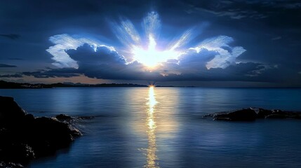 Obraz premium Breathtaking Celestial Glow over Tranquil Seascape at Dramatic Sunset or Sunrise