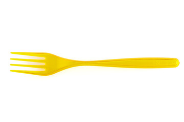 Disposable yellow plastic fork isolated on white background. Close-up. Full depth of field.