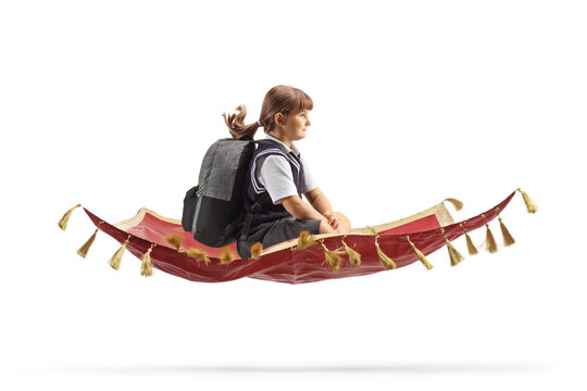 Schoolgirl with a backpack flying on a magic carpet