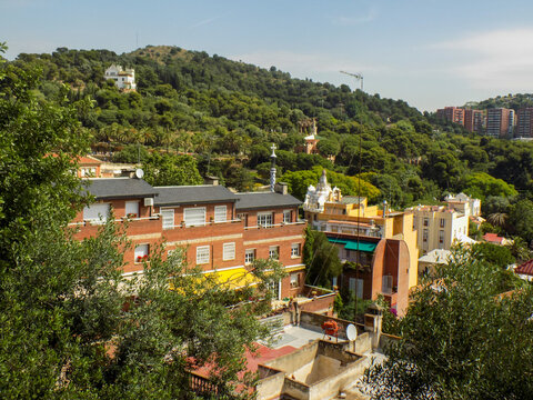 Parque Guell, a monument to Antonio in Barcelona, Spain, , Gaudi looking at the Main Pavilion from the top of the Park